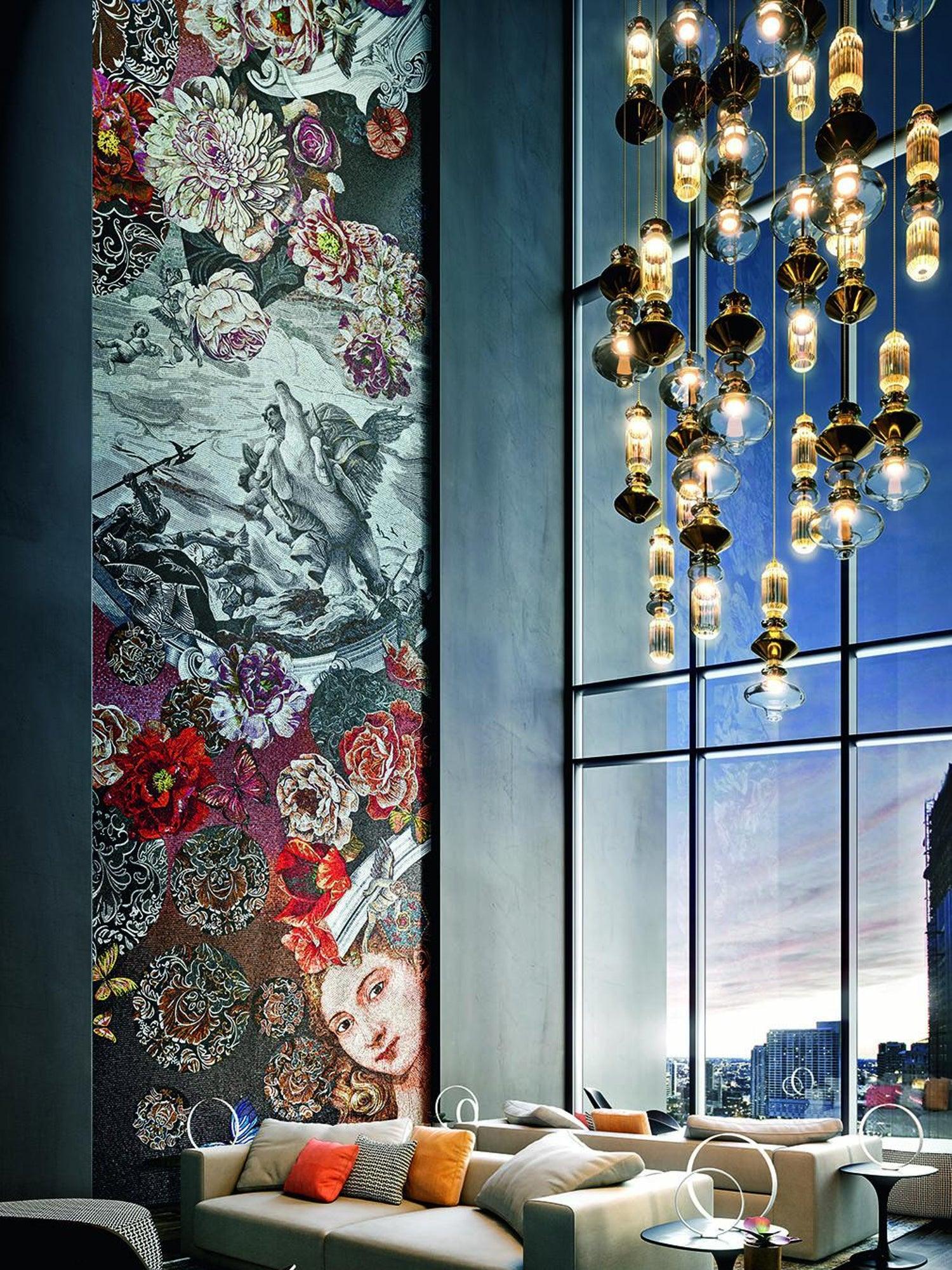 Many glass pendants beside tall windows and floral panels