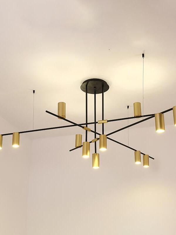 Illuminated gold-coloured heads on crossed black rods