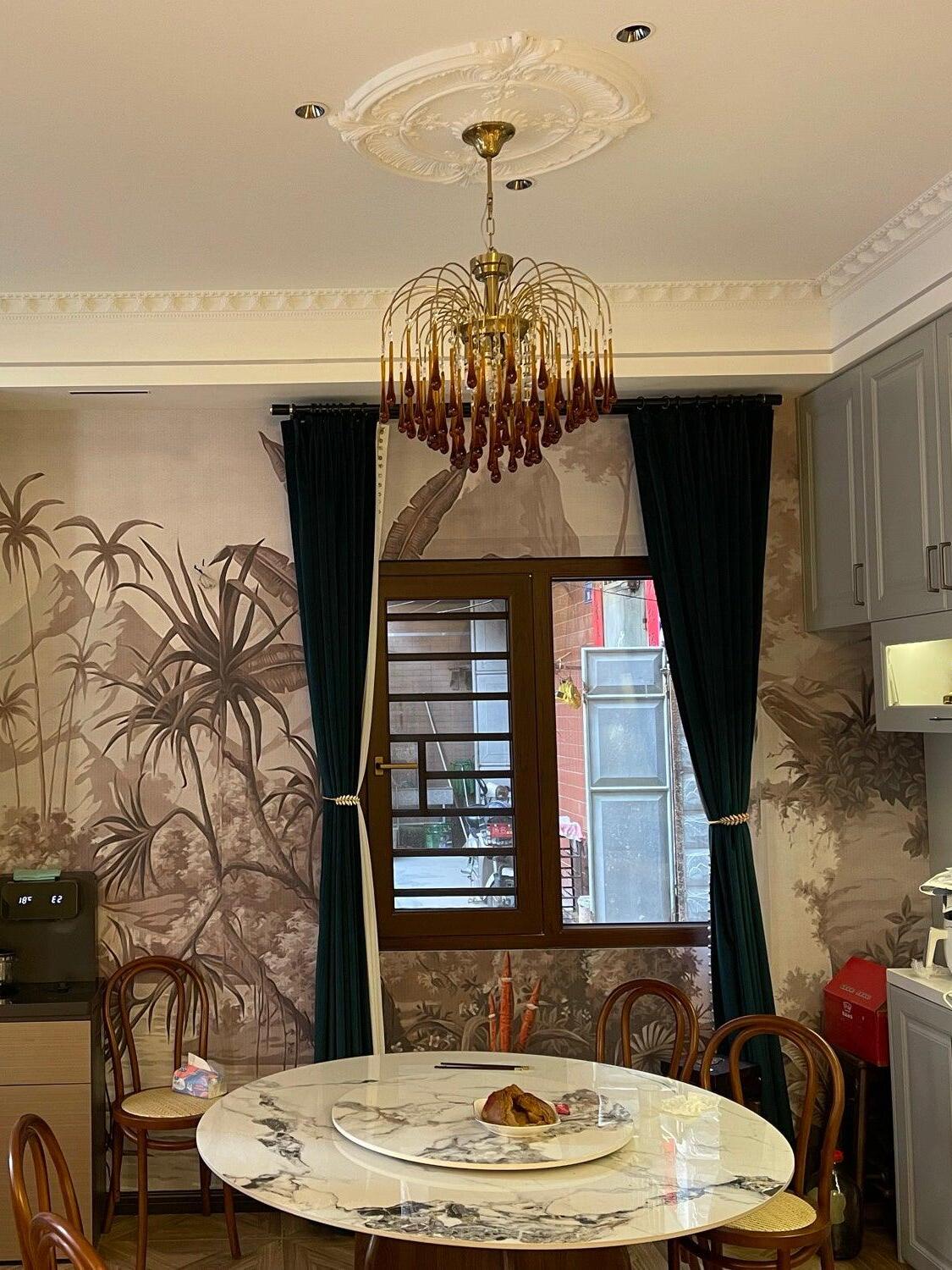 Crystal chandelier above a round dining table