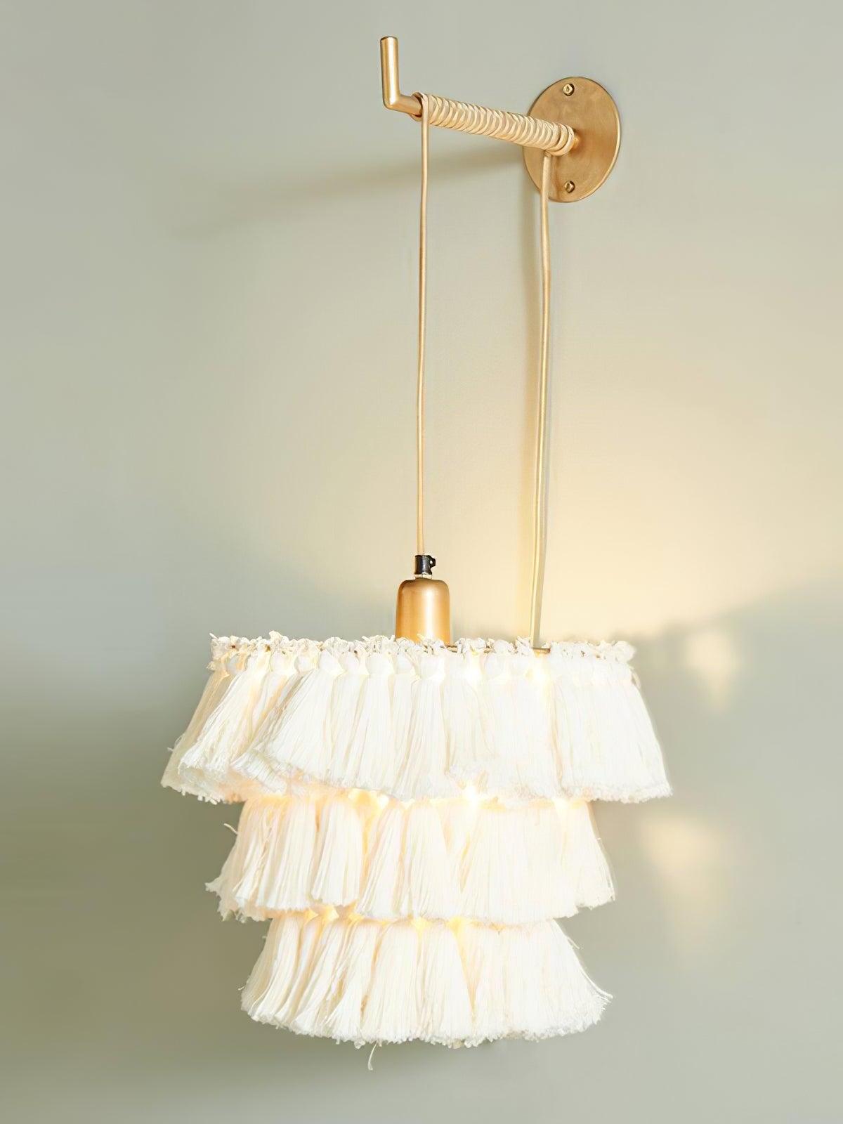 White tiered tassel fixture with a visible power cord