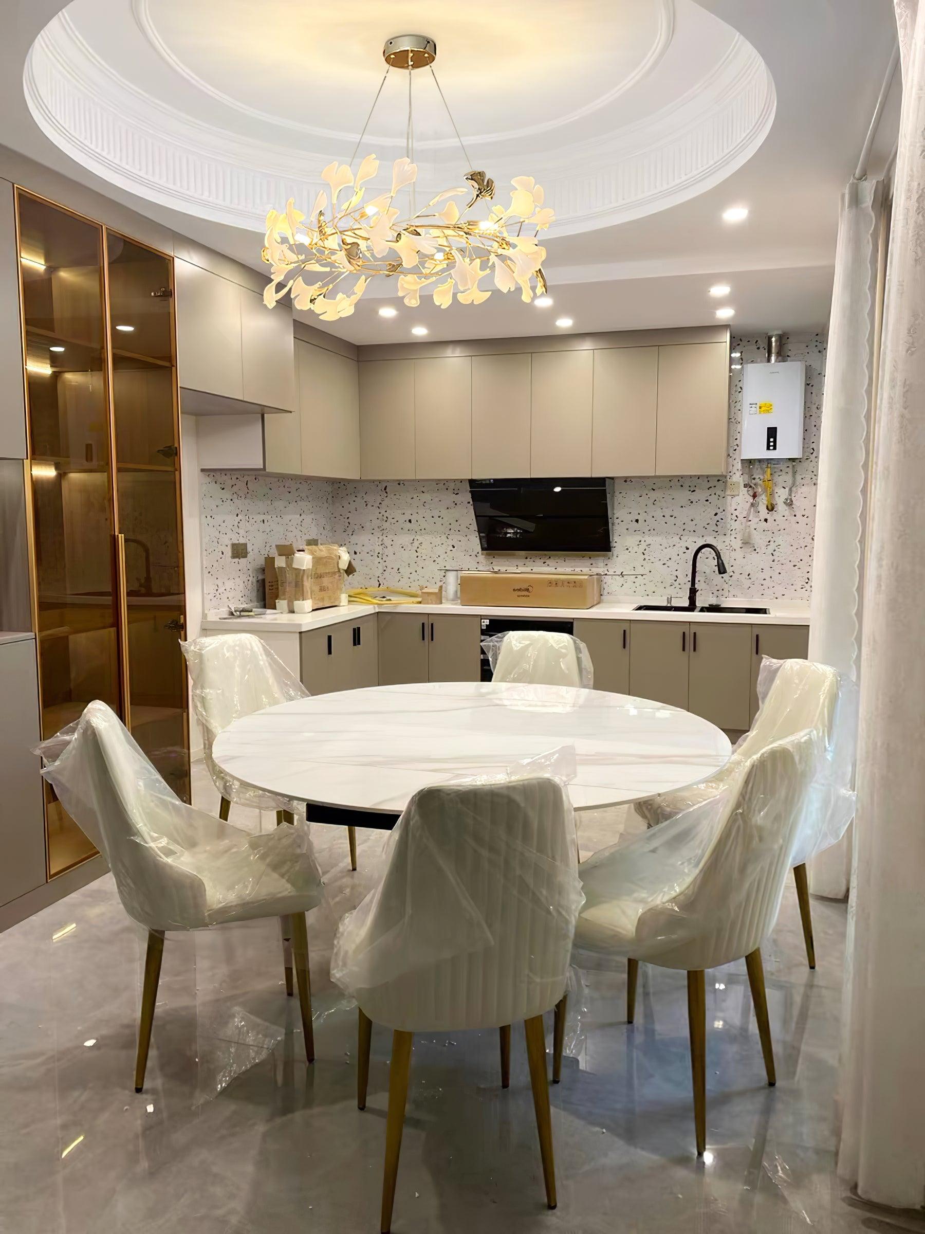 Gingko O chandelier above a round dining table
