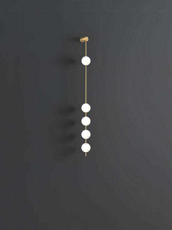 Five-globe wall lamp on a gold-colour rod with an upper cylindrical fitting against dark grey