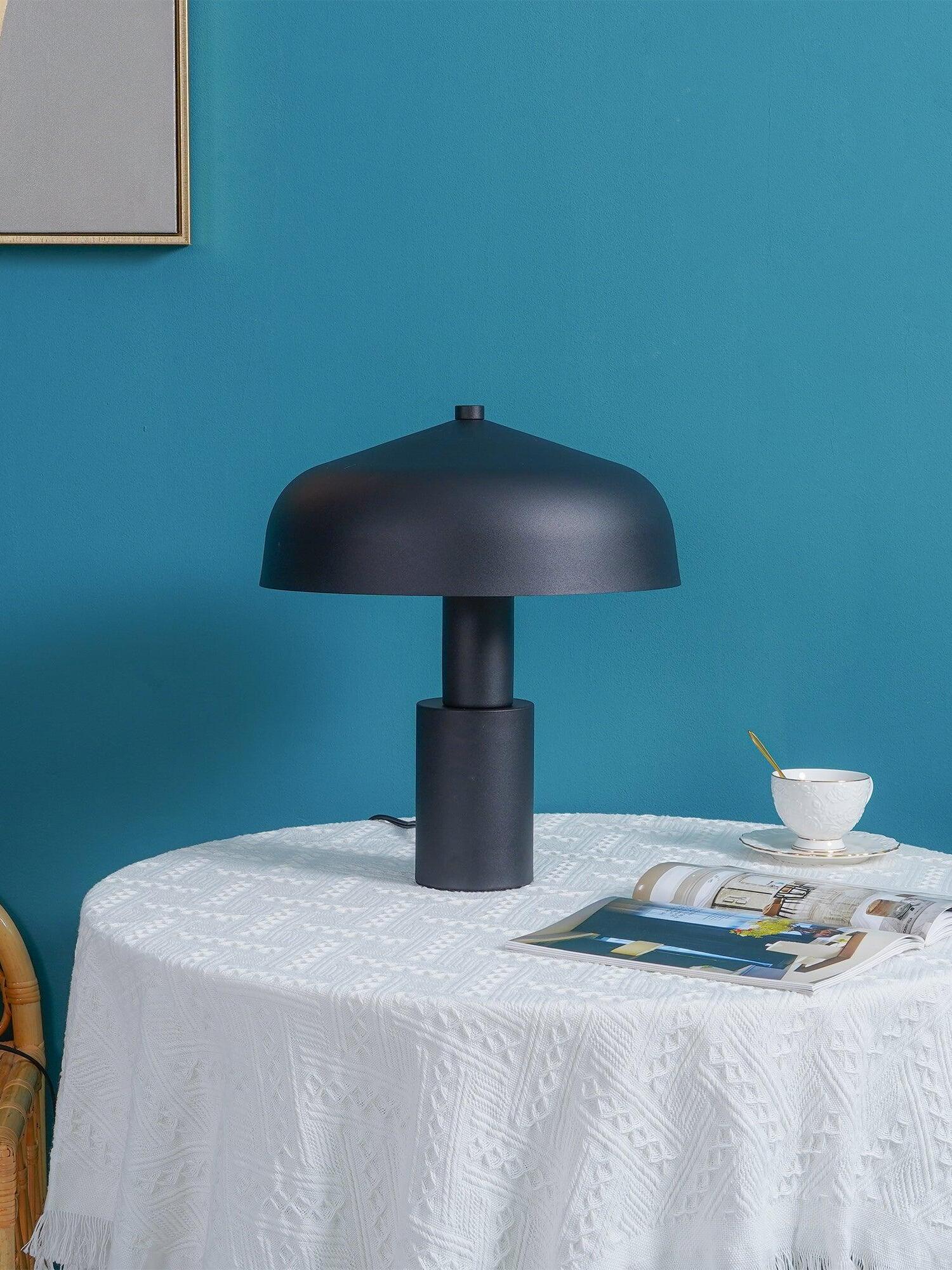 Black dome lamp on white-covered table