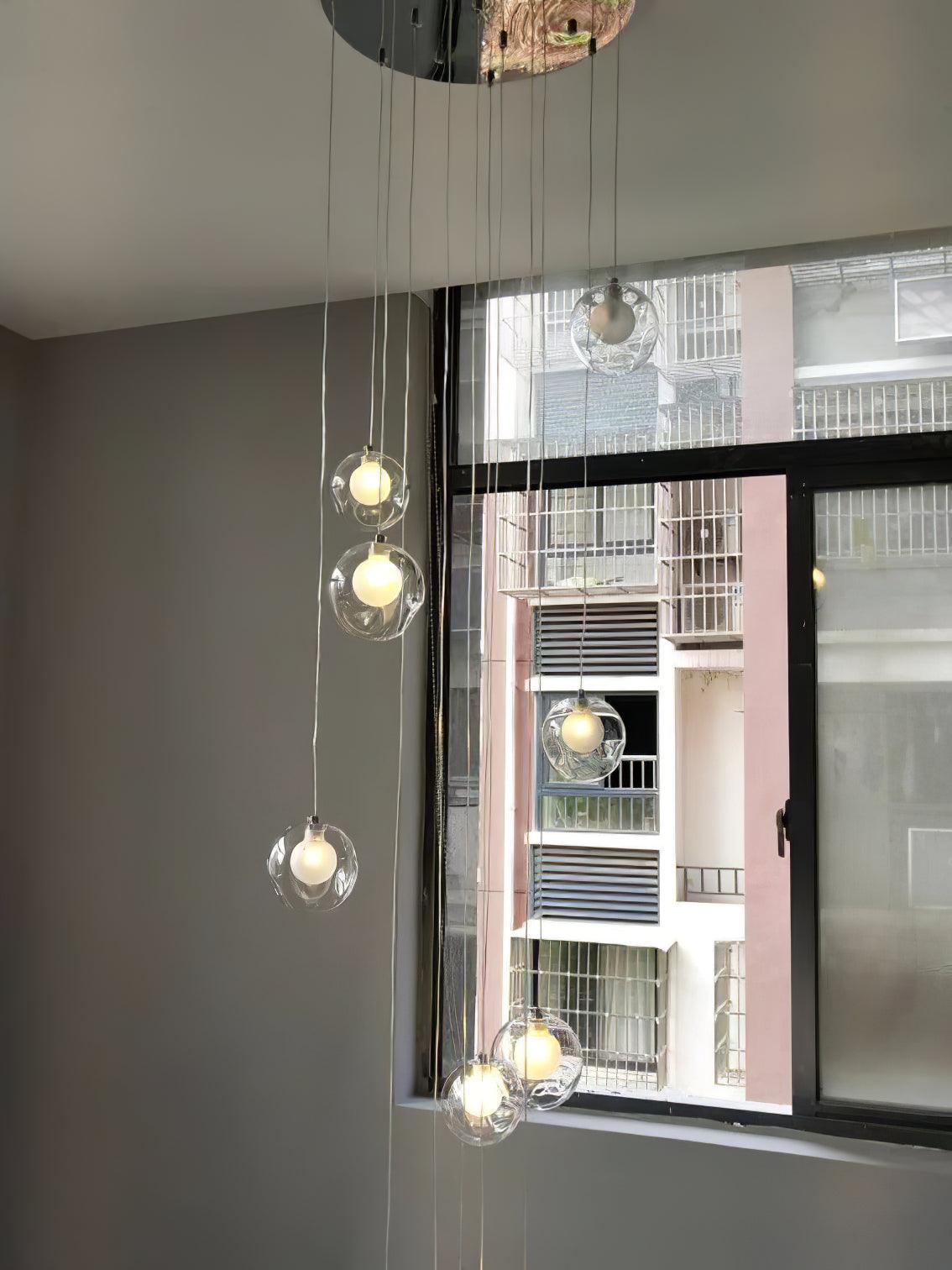 Small group of clear globes in front of tall window