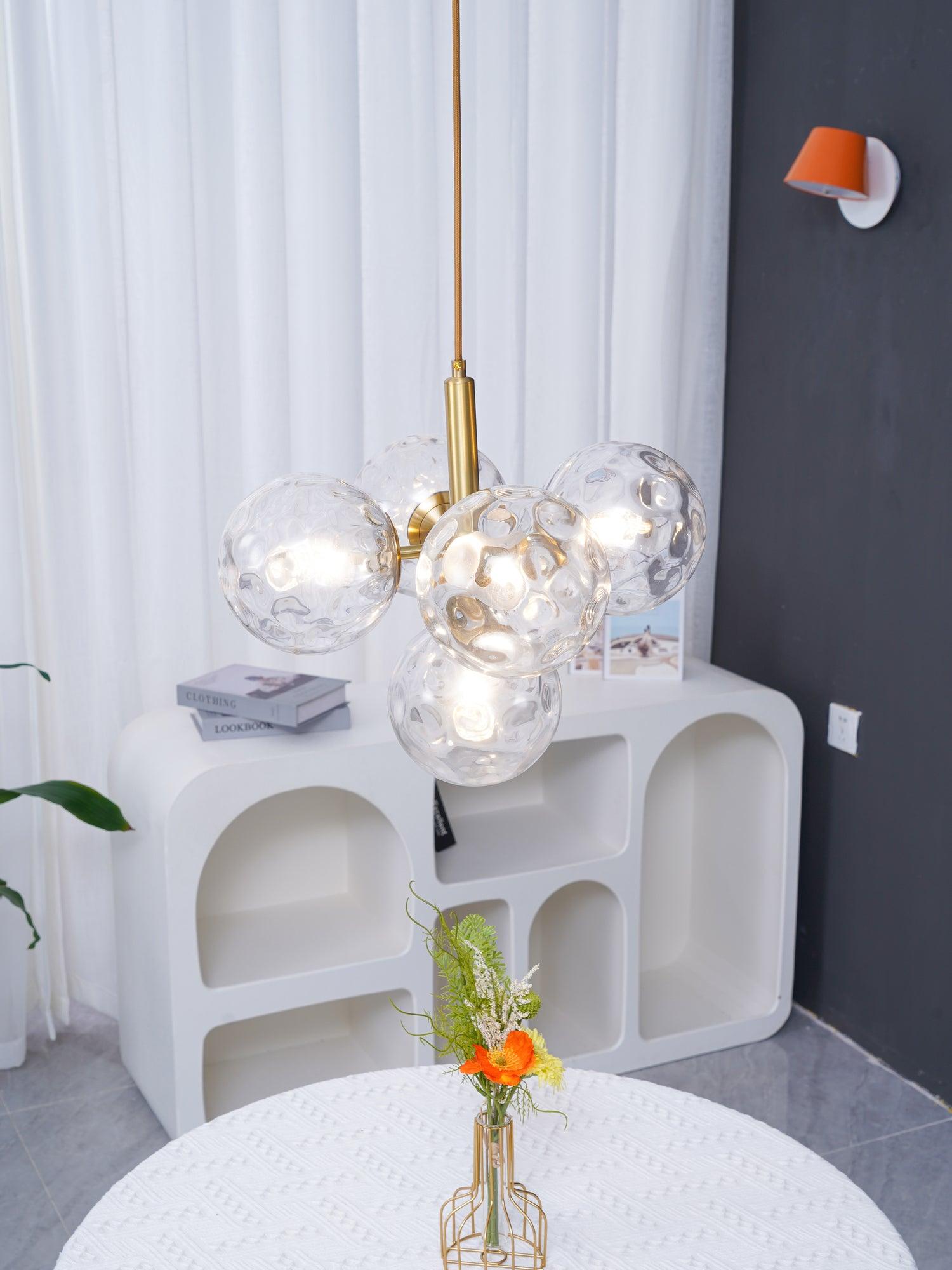 Textured clear globes above a decorated round table