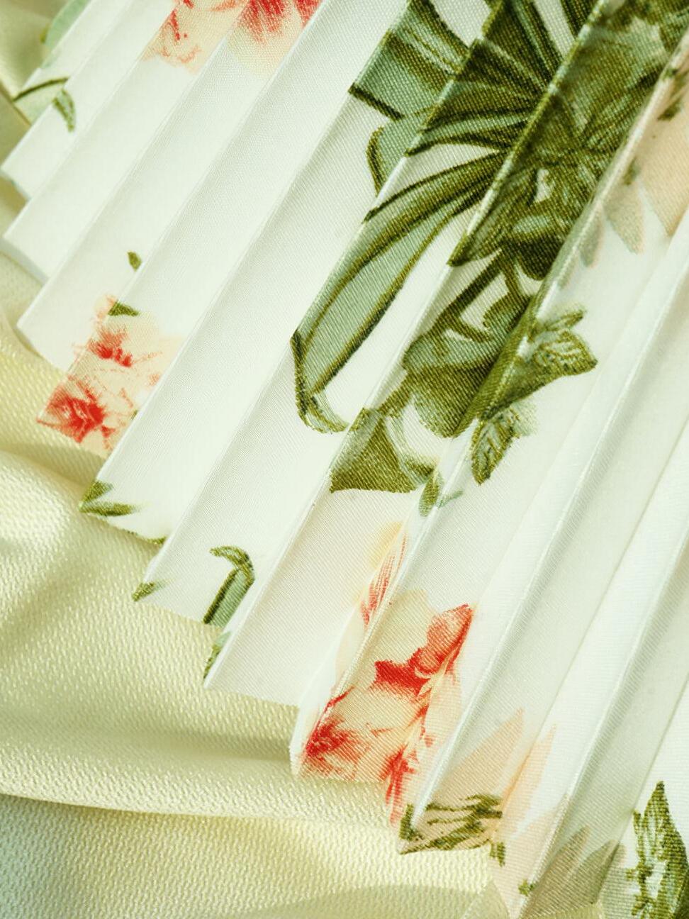Close view of floral print on pleated shade