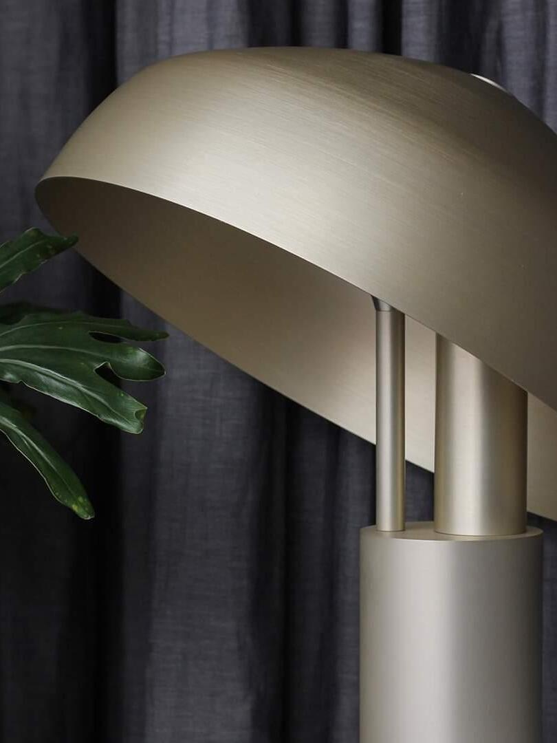 Close view of tipped gold dome and slim supports