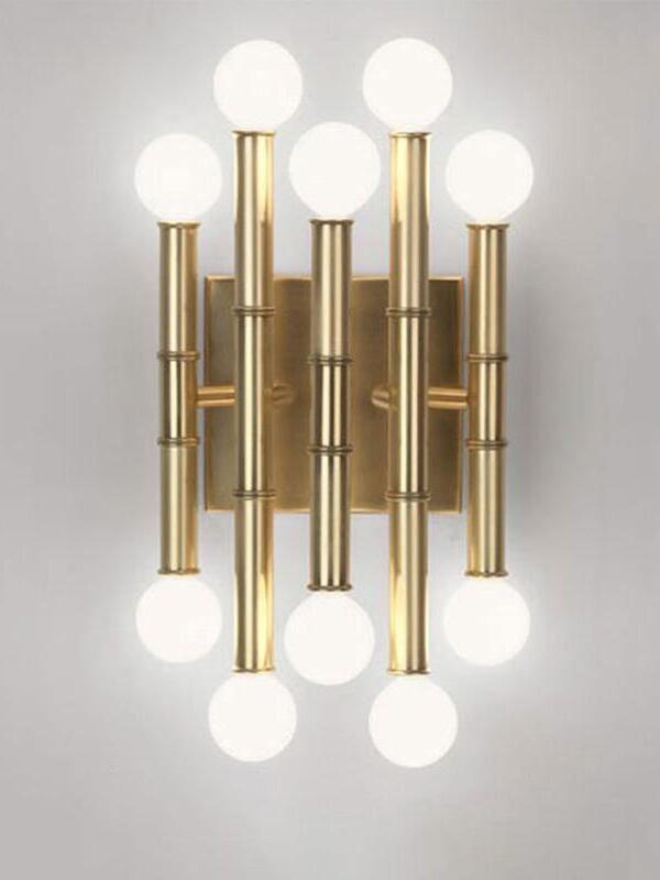 Gold-tone Meurice isolated against gray, with five staggered jointed stems and ten white globe bulbs