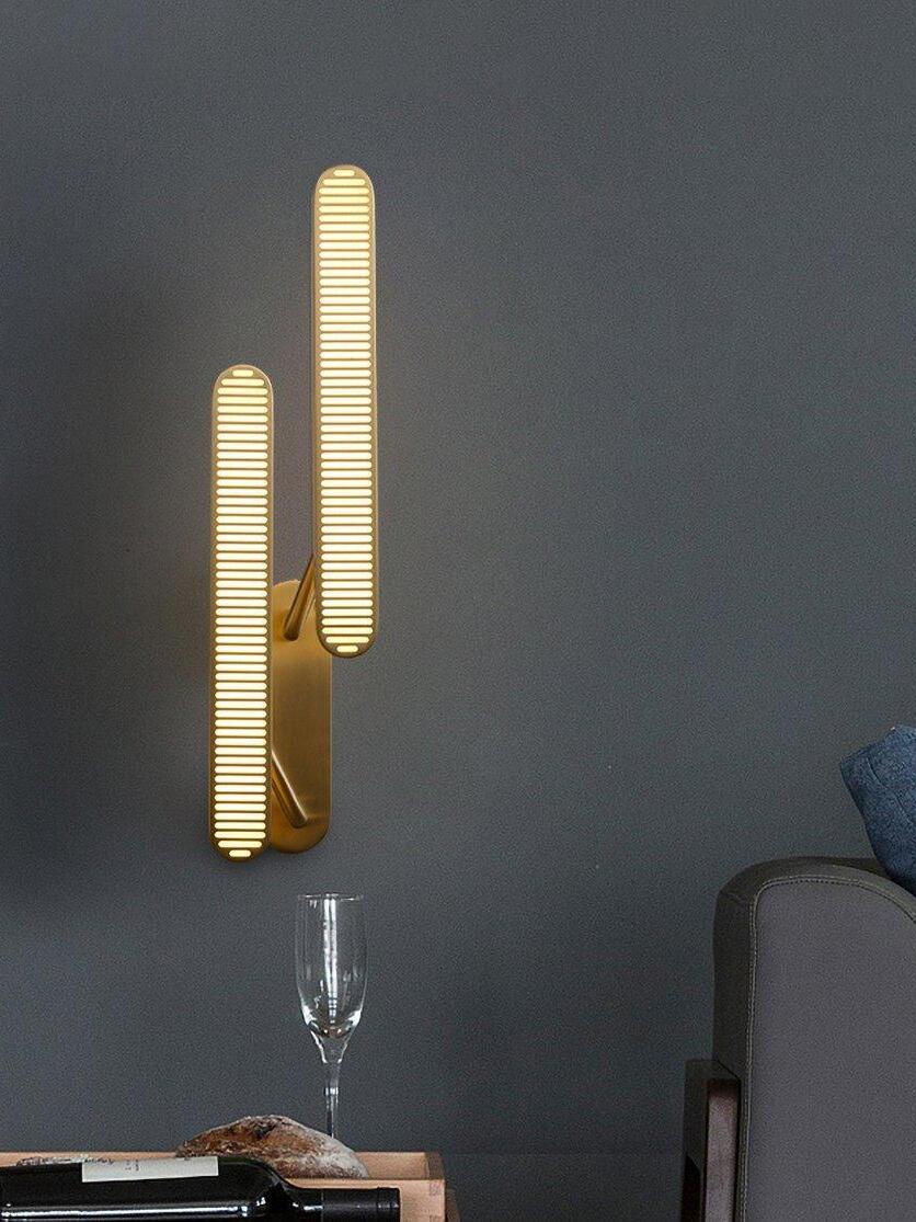 Lit staggered grille bars against Dark Gray beside an armchair and table with a wine glass, bread and bottle