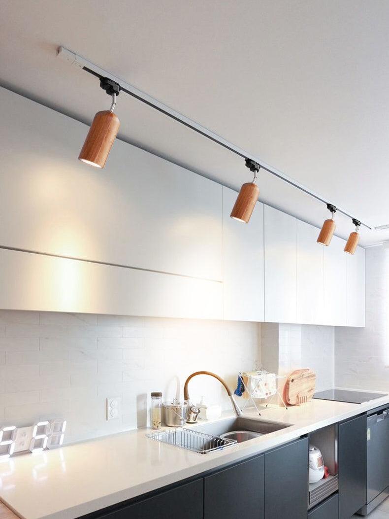 Wood track lighting over kitchen counter