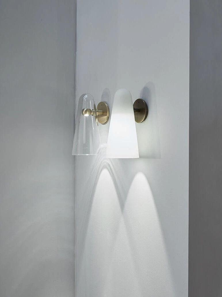 Gallery view of clear and pale glass wall shades