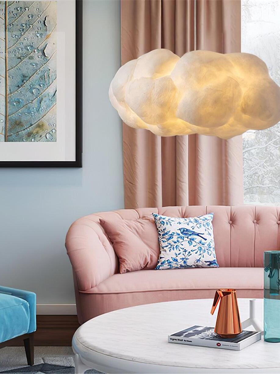 Cloud pendant over a pink sofa
