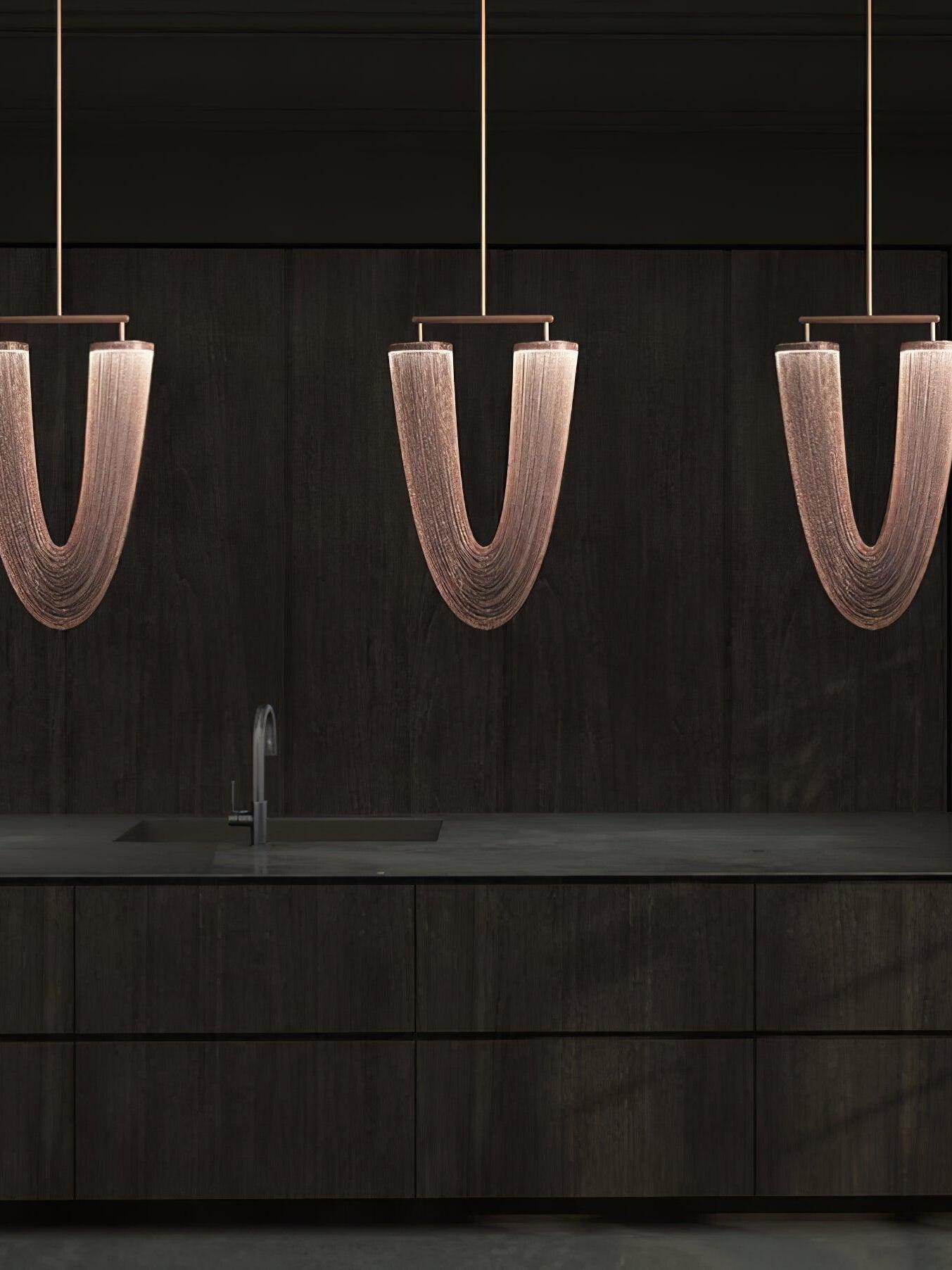 Three chain pendants above a long console