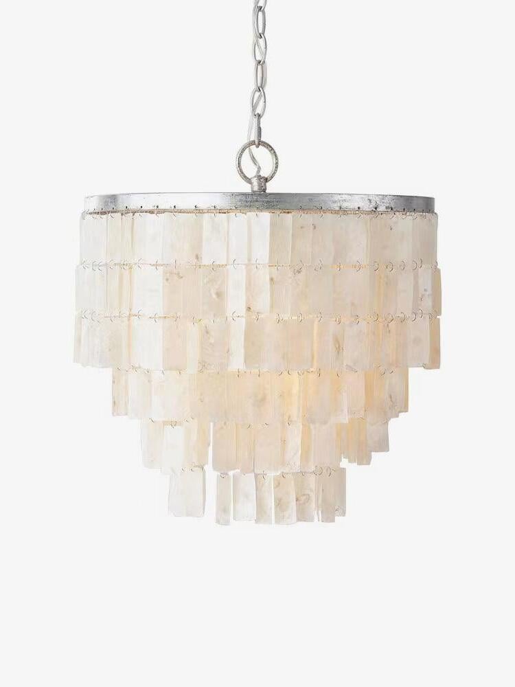 Skye pendant with tiered natural shell pieces on a plain background