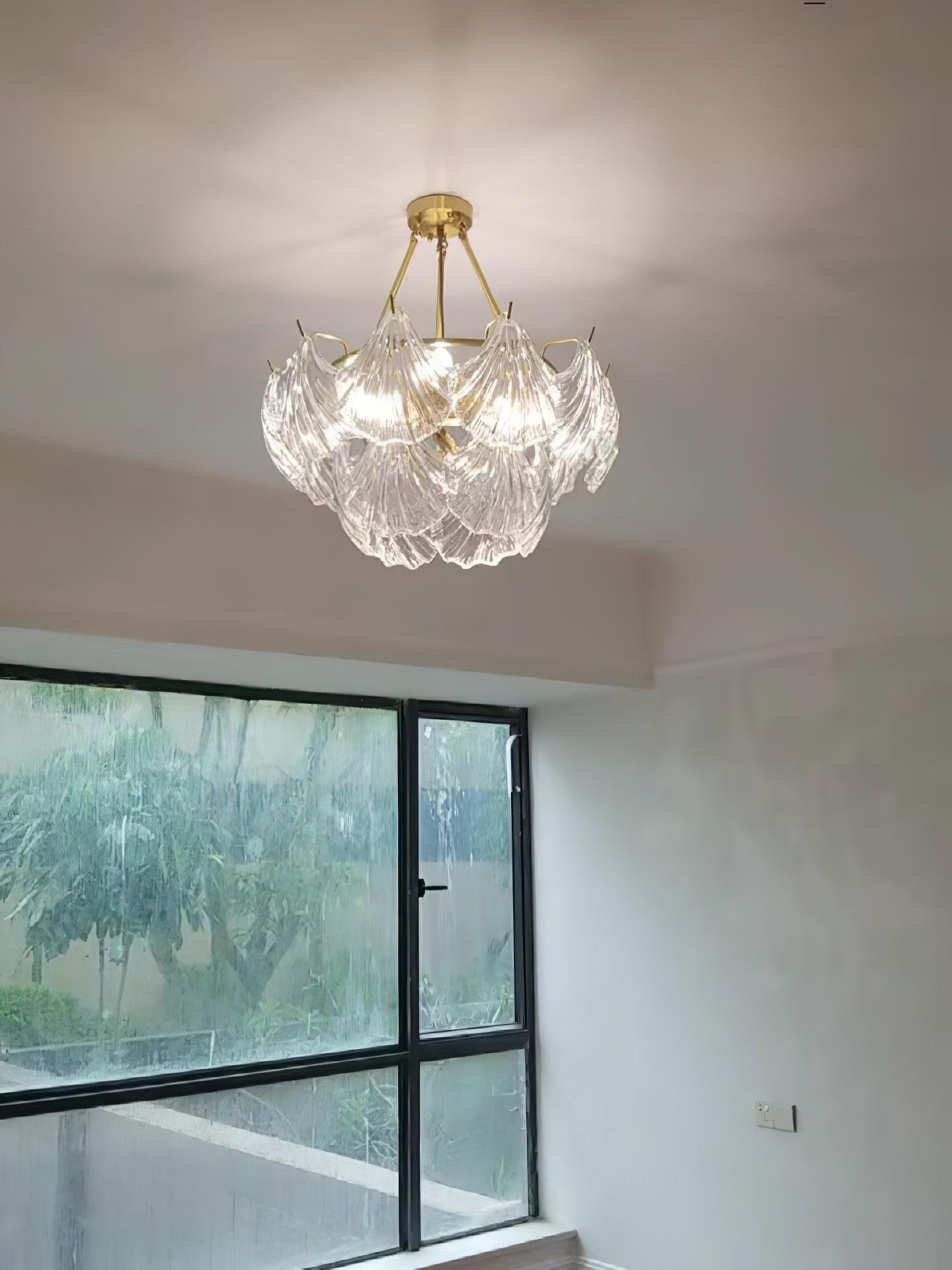Illuminated round shell-panel fixture in an unfurnished room beside a window