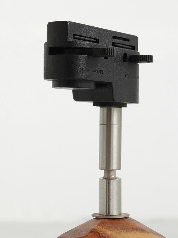 Close-up of black track connector and silver joint