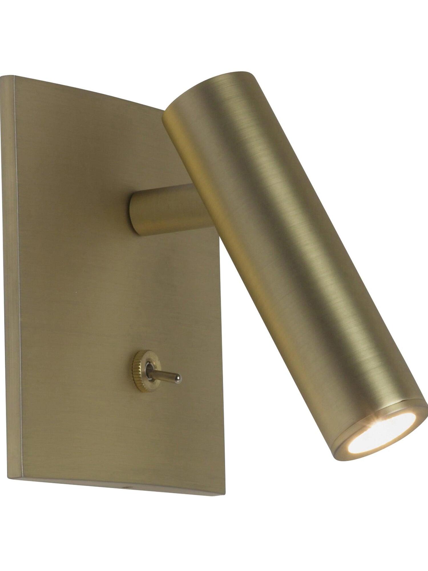 Close view of Enna gold-tone square plate, lower toggle, short stem and angled cylindrical head with illuminated circular opening
