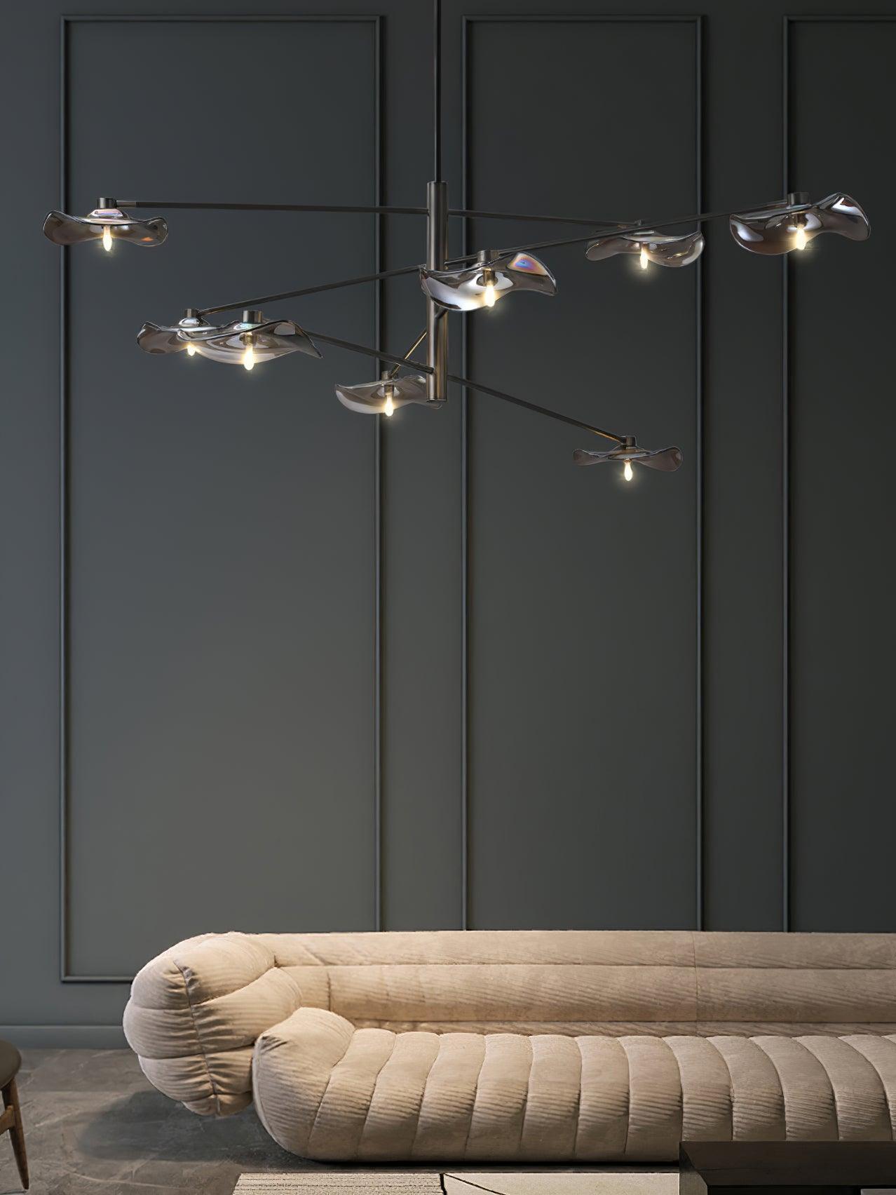 Tiered glass chandelier against dark wall panelling