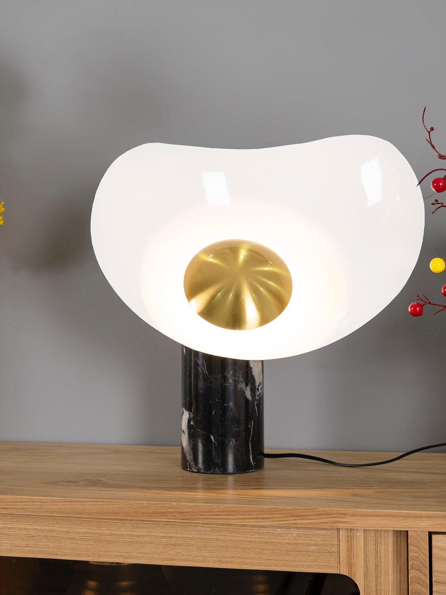 Lit curved white shade and gold centre over veined black base