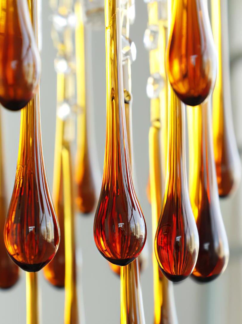Close-up of amber drops with darker rounded ends