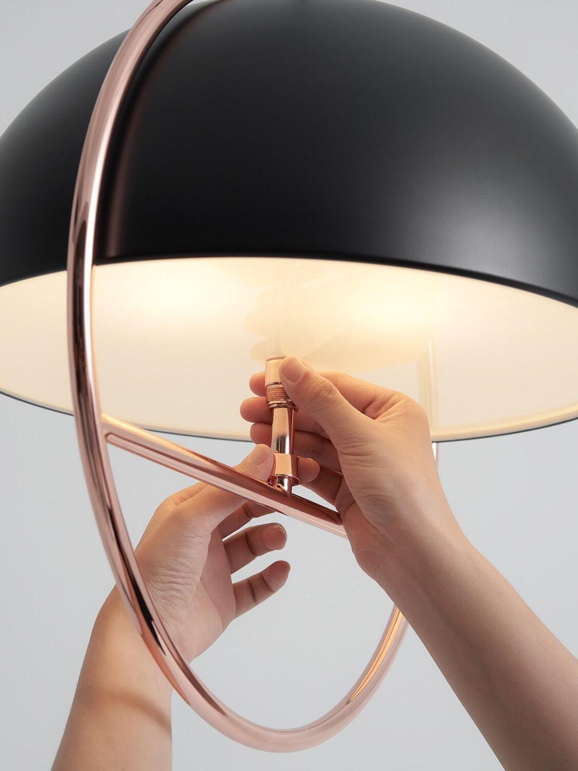 Close black dome, rose metal ring and lower crossbar