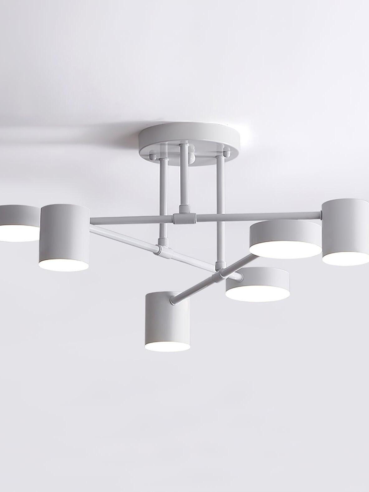 Close view of a white six-head ceiling light with lit round faces, crossed arms, short stems and round canopy