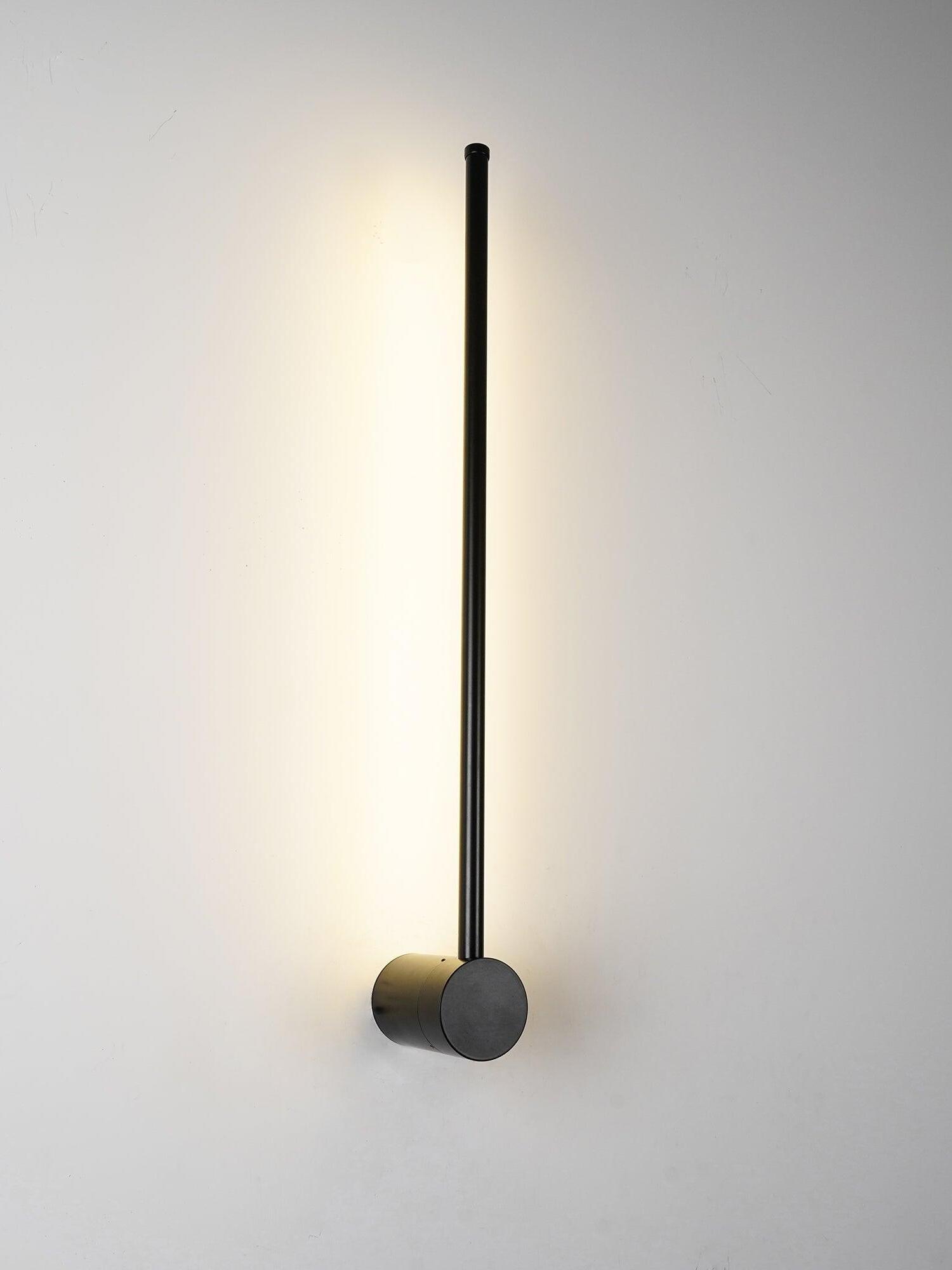 Angled view of a glowing rod and black cylindrical mount