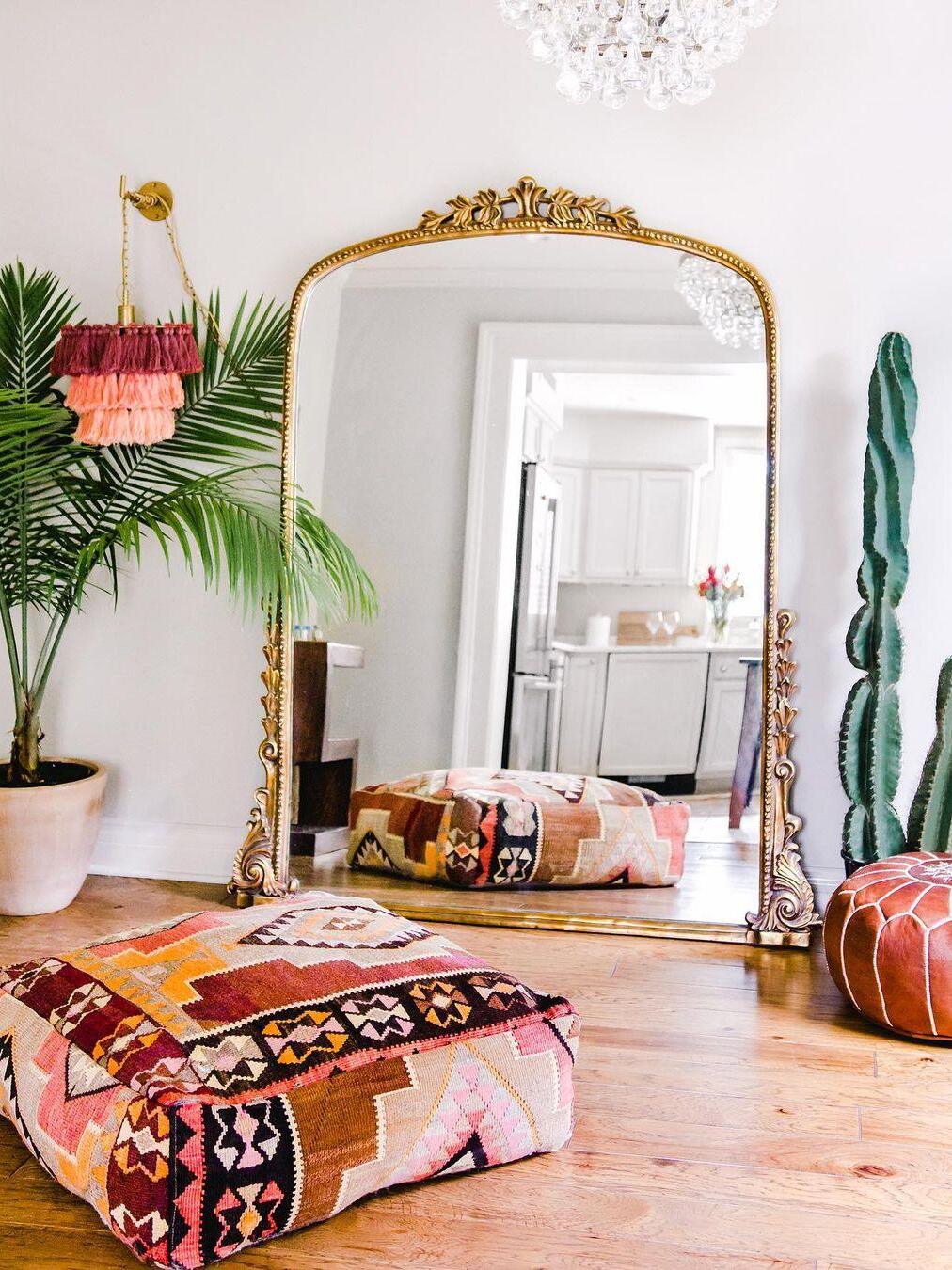 Colourful room with tassel wall lights and a large mirror