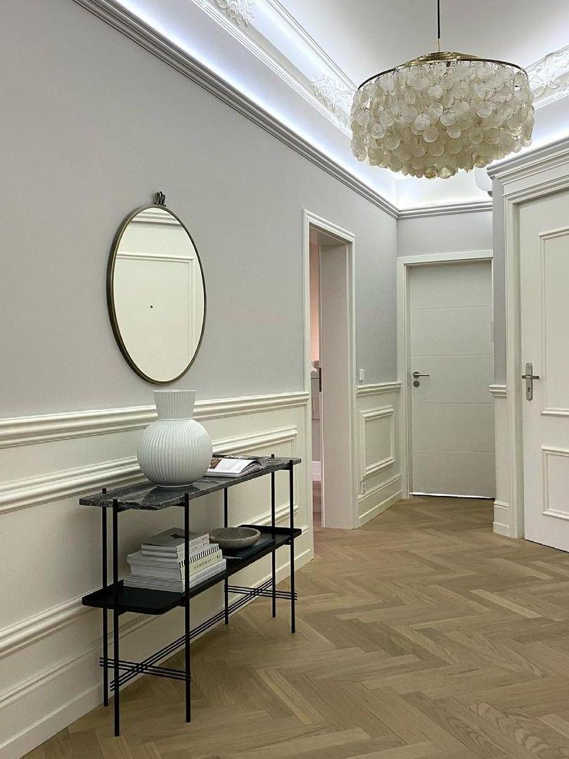 Shell chandelier in a pale hallway
