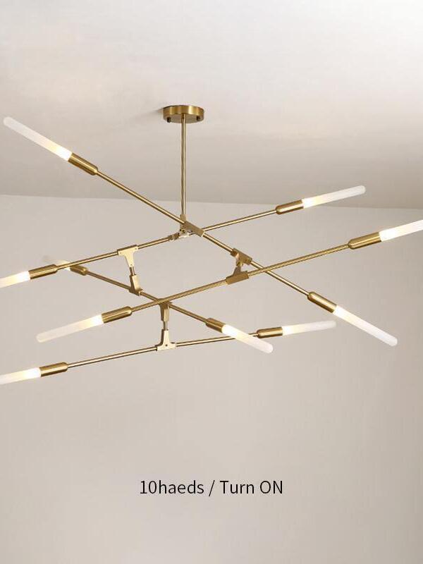 Gold chandelier pictured with ten-head label and lights on