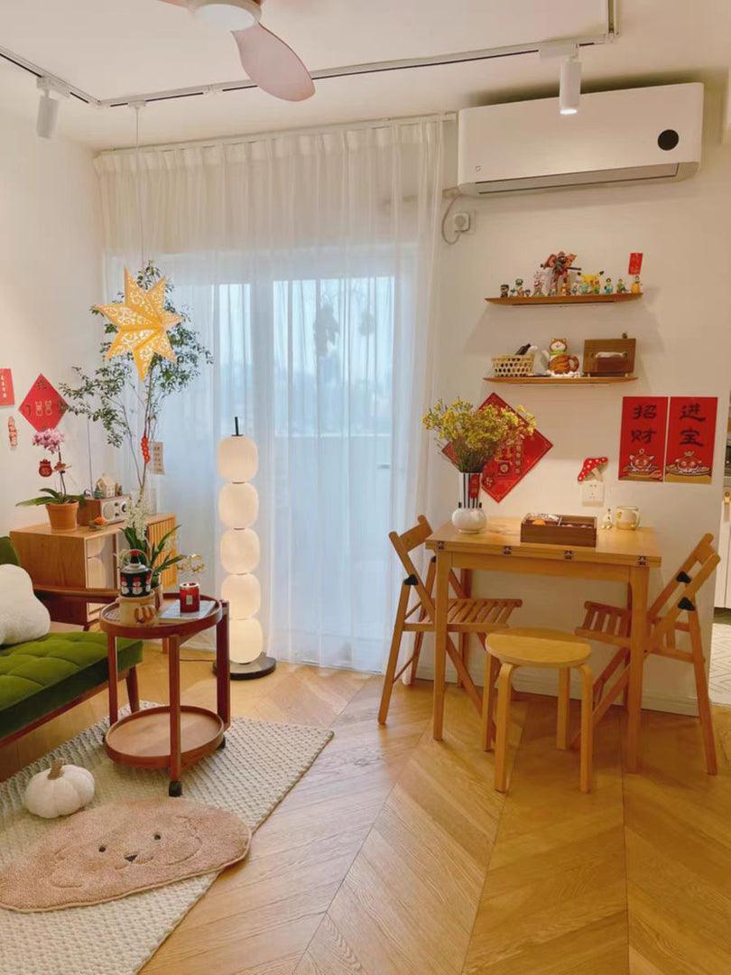 Globe lamp in a bright living and dining room