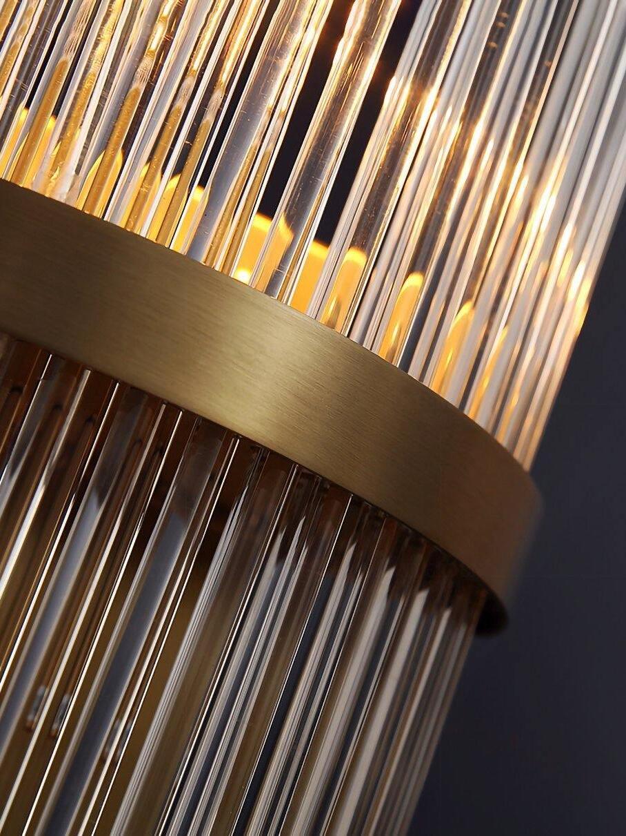 Close clear rods and broad brass centre band of wall light