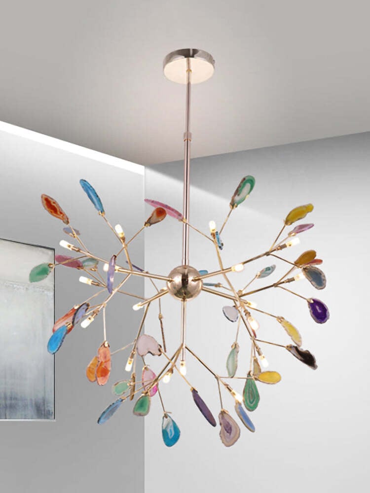 Multicoloured stone chandelier below a ceiling canopy