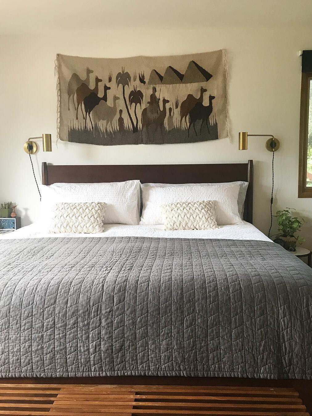 Front bedroom view with pair of brass-tone wall lights