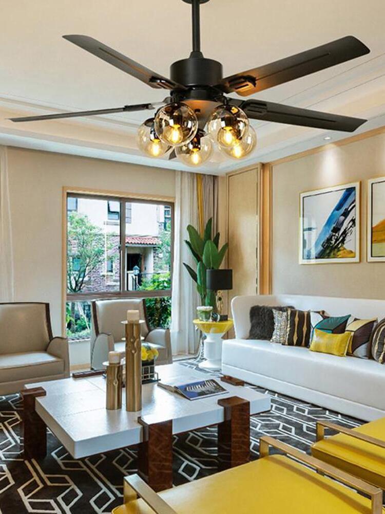 Black fan chandelier above a living-room table