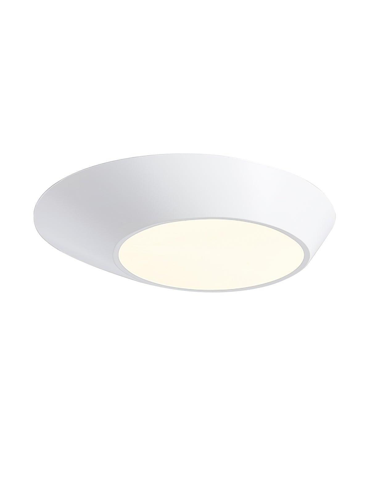 White angled round ceiling light with an off-center glowing diffuser isolated on white