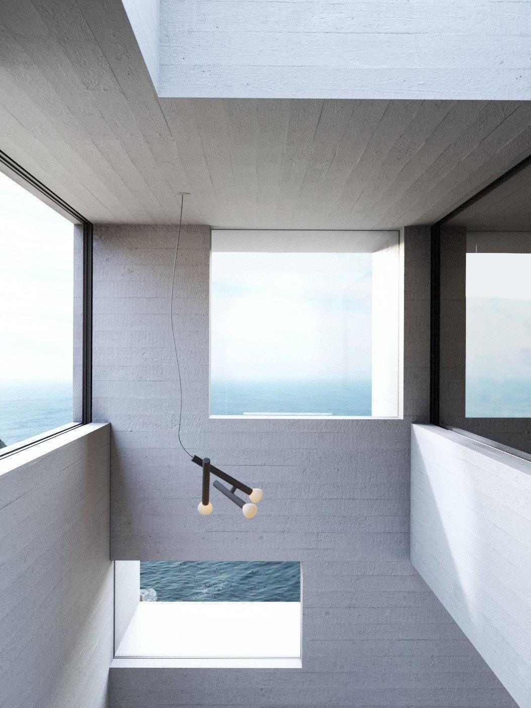 Two-head pendant within a tall skylit space
