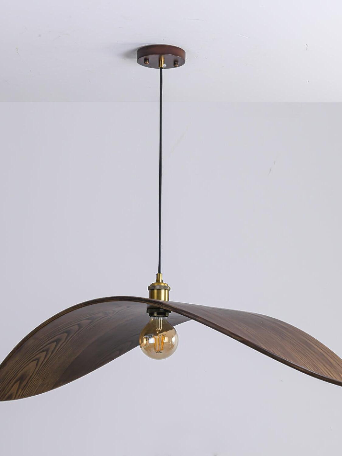 Unlit central bulb and curved wood-grain wings beneath a dark canopy and black cable