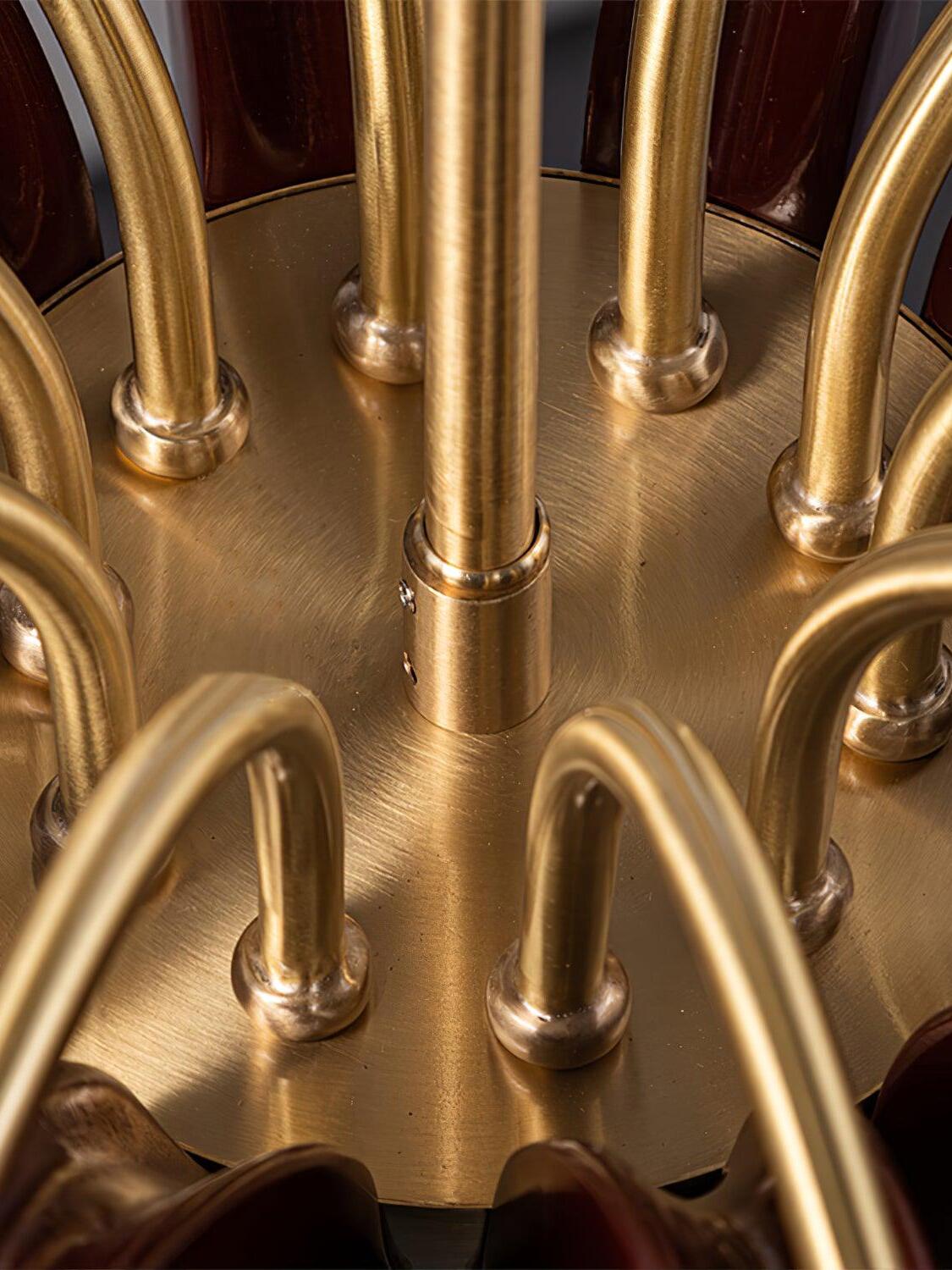 Close view of brass-colour hub and arm joints