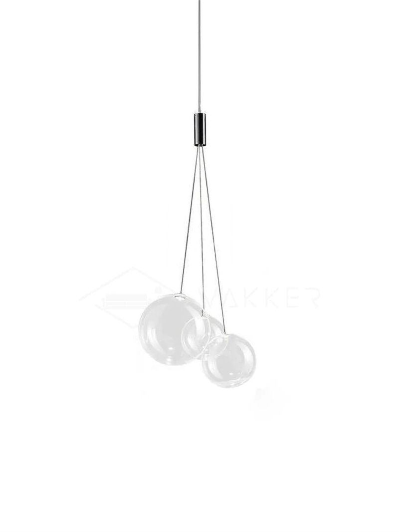 Clear three-globe glass pendant on white with graduated sphere sizes, thin suspension branches and a chrome junction