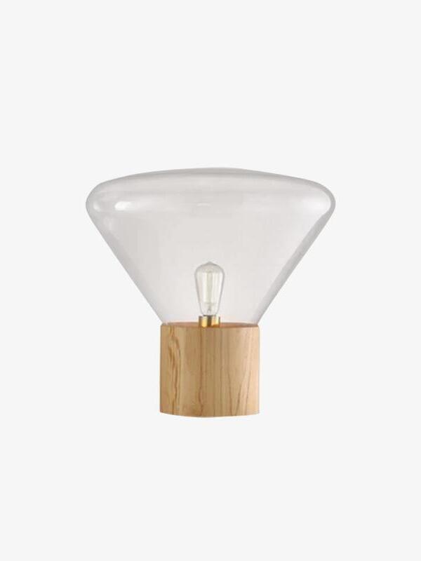 Isolated clear flared glass shade with unlit bulb and light cylindrical wood base