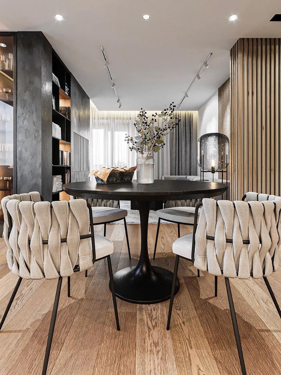 Tall glass lamp at the end of a contemporary dining room.