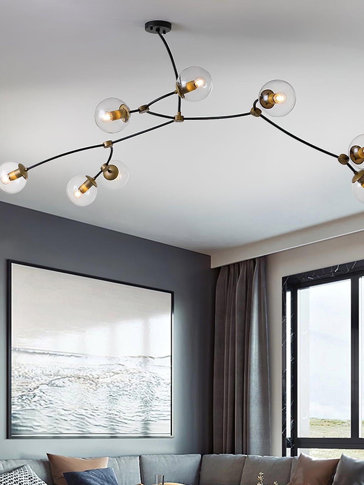 Wide clear globe arrangement beside large windows