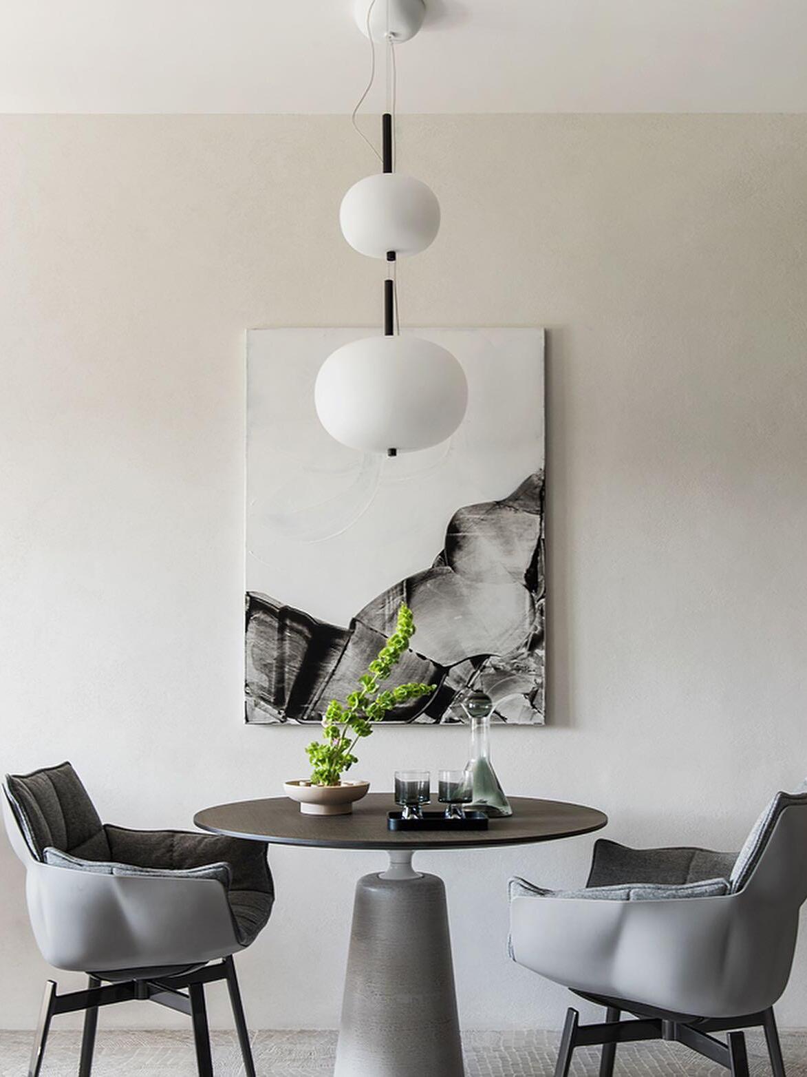 Globe pendants above a dining arrangement