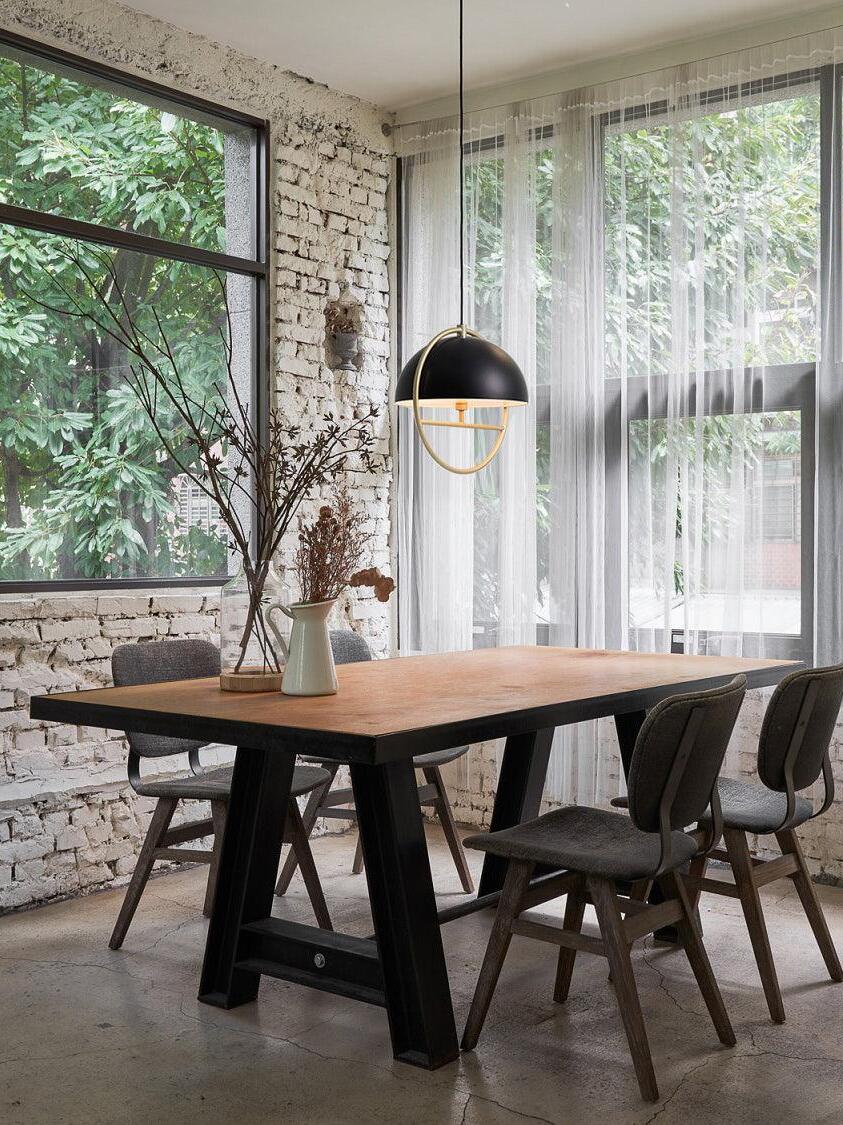 Black dome ring light over dining table