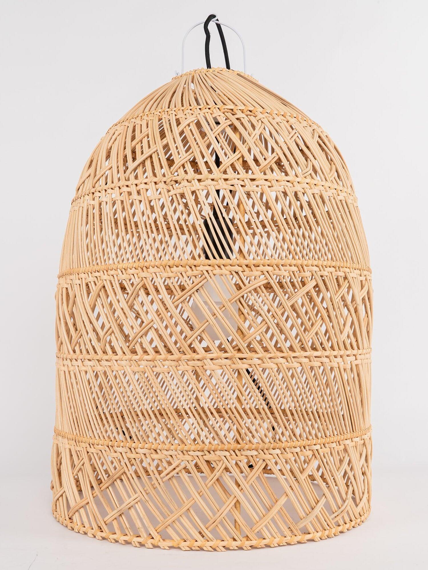 Tall natural basket shade on a plain background