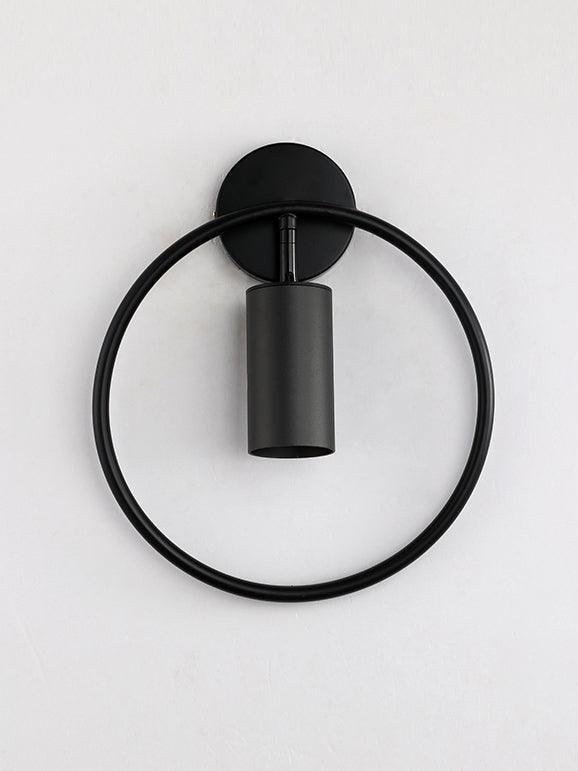 Black Revolta ring-frame wall light with its cylindrical head shown unlit.