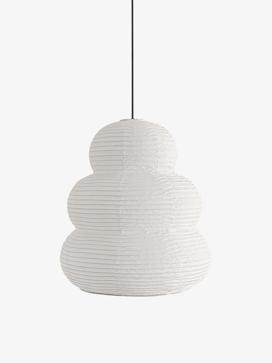 Unlit three-tier white paper pendant on dark cord