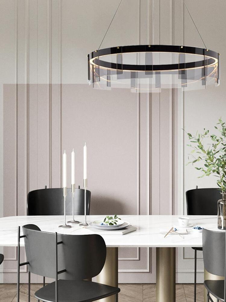 Stratos ring above a dining table with candles
