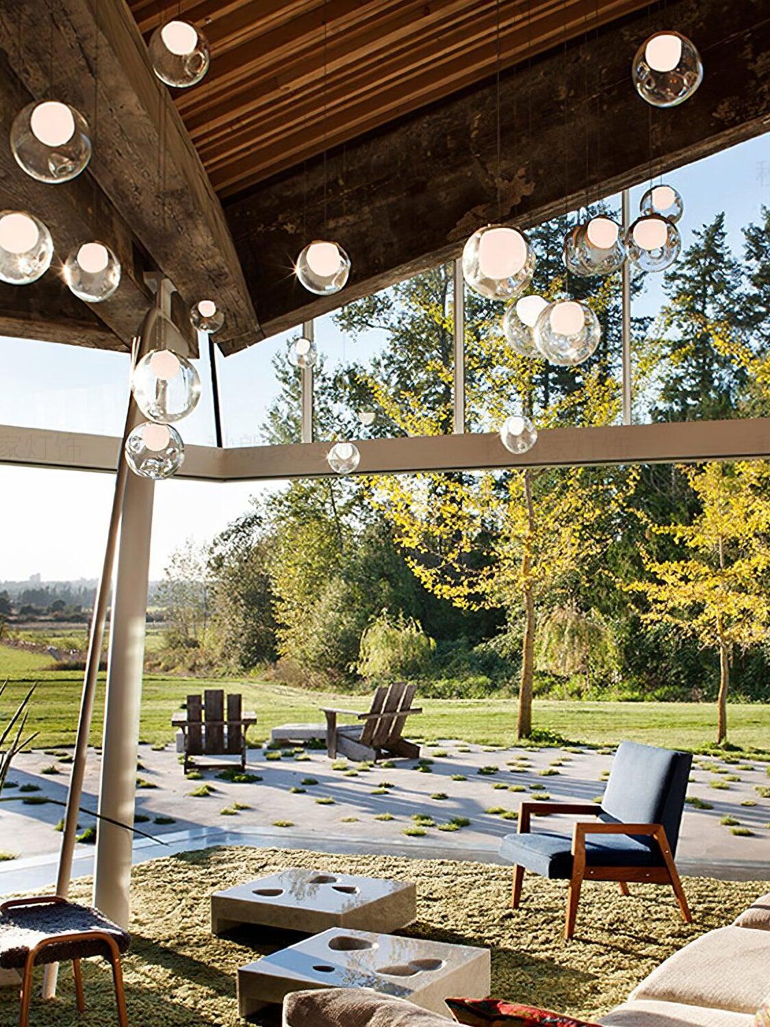 Clear globe lights beneath covered open patio roof